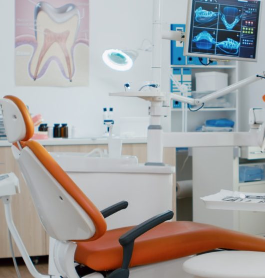 Interior of dentist stomatology orthodontic office with teeth radiography on monitor. Empty dental hospital room with nobody in it prepared for tooth diagnosis. Zoom in shot of medical workplace